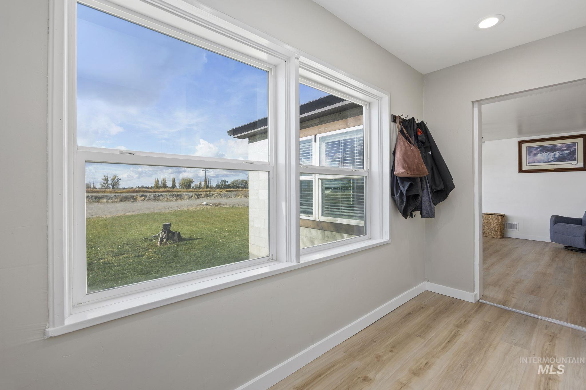 128 South 100 East Rupert, ID 83350 - Photo 5 of 44 Detailed view of wood finished floors and recessed lighting