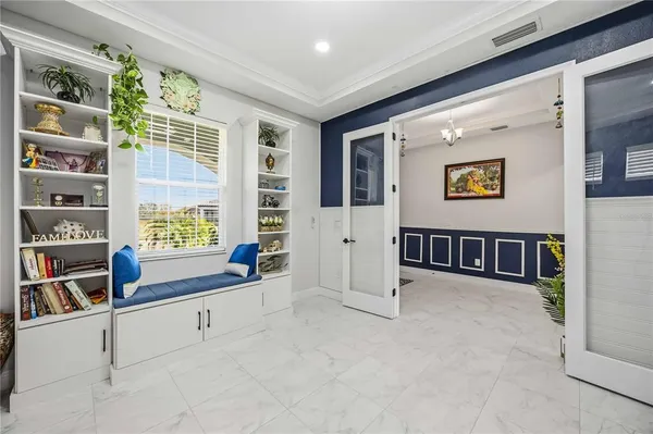 a kitchen with a sink a counter top space and stainless steel appliances