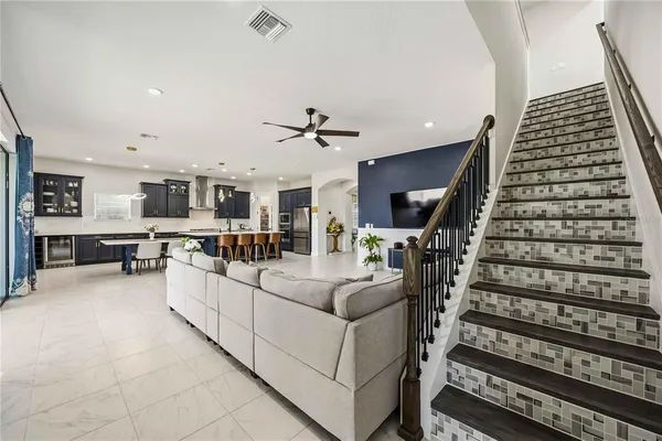 a kitchen with granite countertop a stove and a refrigerator