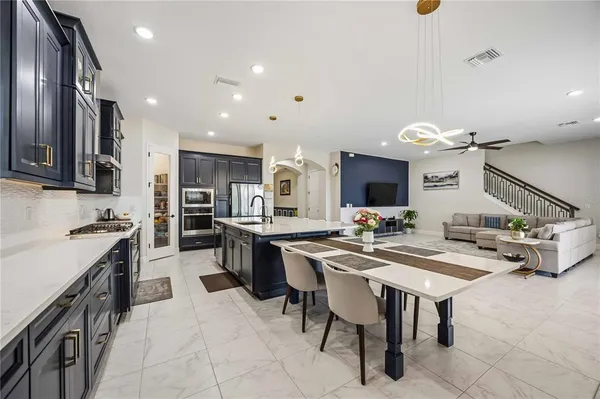 a living room with furniture a clock and a window