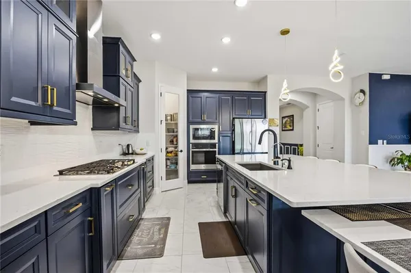 a living room with furniture and a ceiling fan