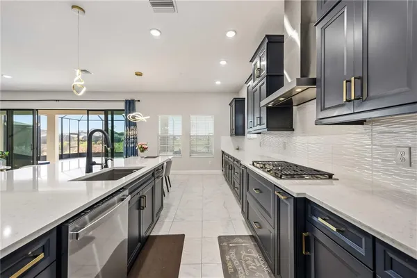 a living room with furniture and a ceiling fan