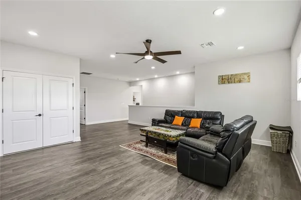 a bedroom with a bed and a chair