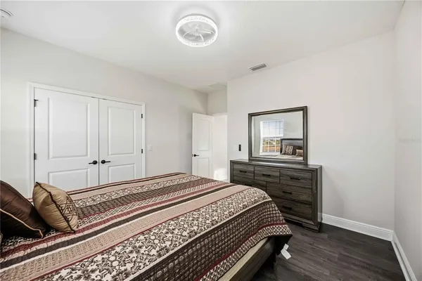 a bathroom with a sink a large mirror and a bathtub with shower