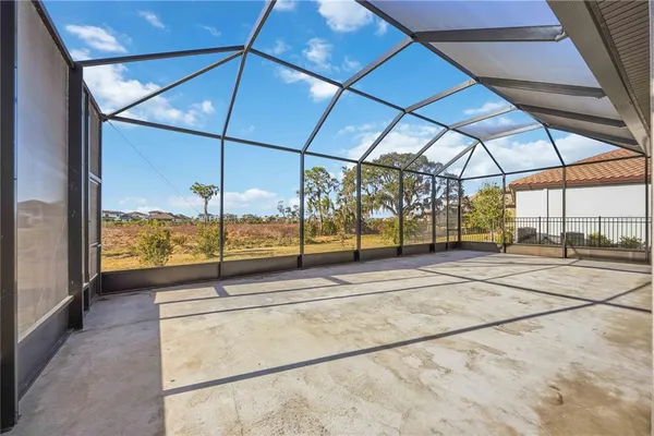 a view of a table and chairs under an umbrella