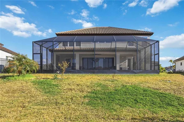 a view of a chairs and table in patio