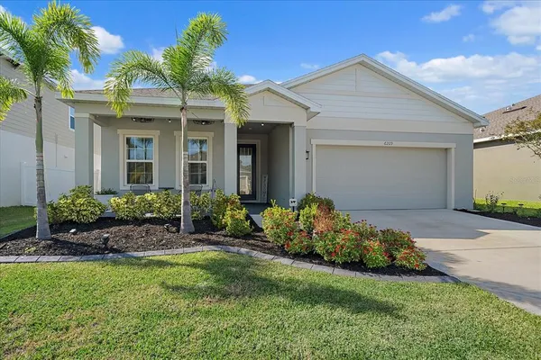 front view of a house with a yard