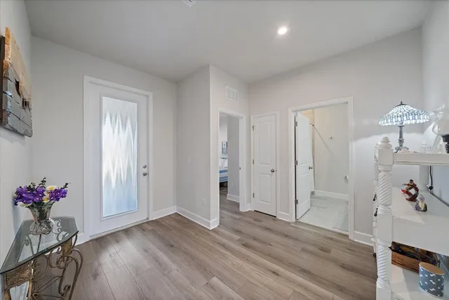 a bathroom with a granite countertop sink a toilet and a mirror