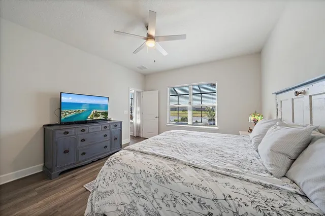 a view of a patio with table and chairs under an umbrella