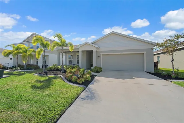 a kitchen that has a sink and a stove top oven