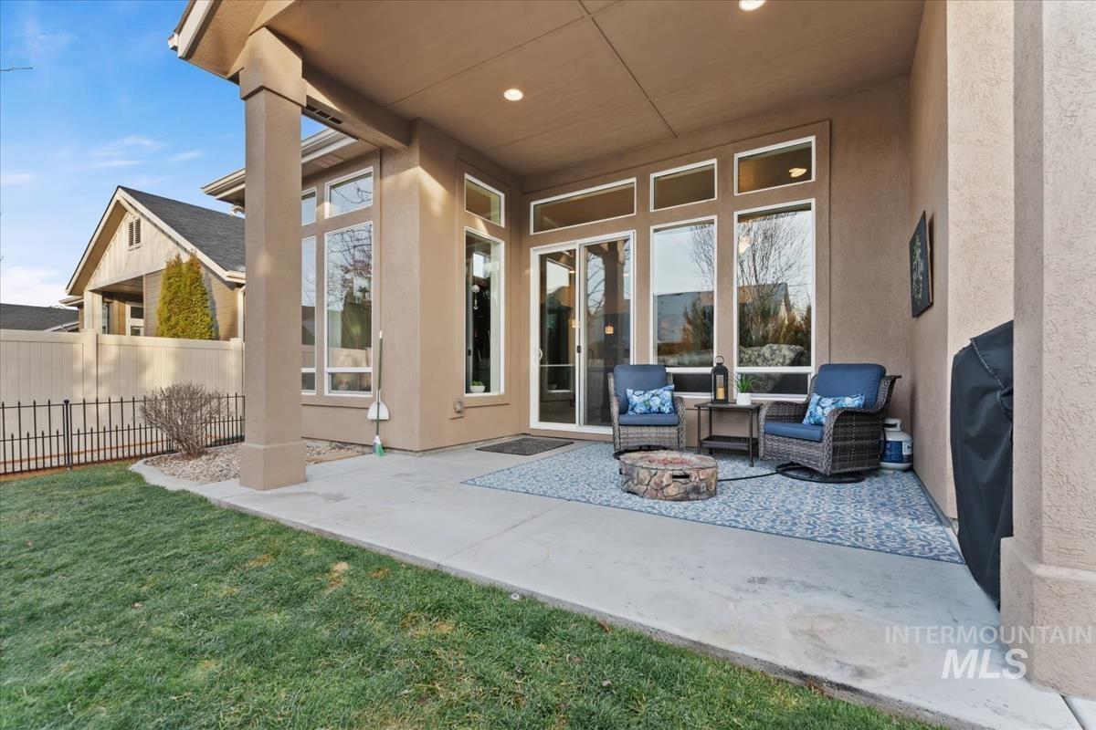 1447 West Arch Rock Street Meridian, ID 83646 - Photo 31 of 43 View of patio / terrace featuring an outdoor living space with a fire pit