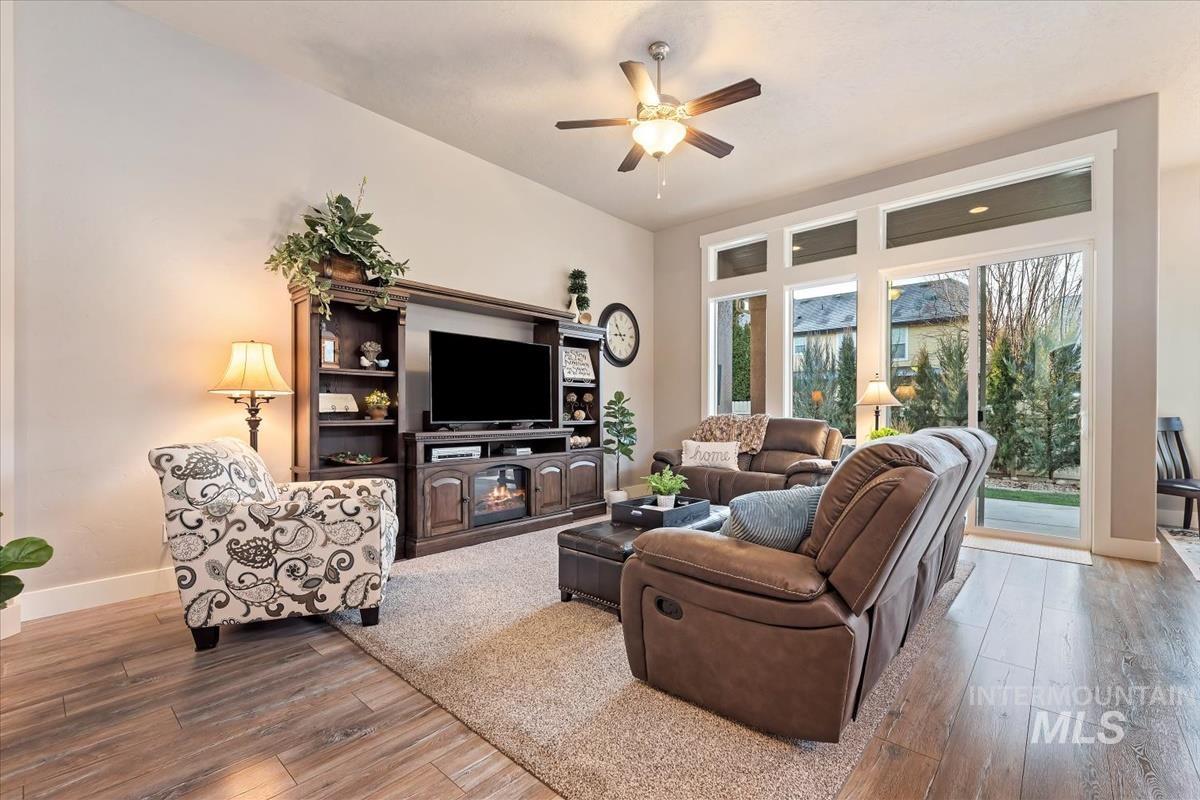 1447 West Arch Rock Street Meridian, ID 83646 - Photo 7 of 43 Living room with light wood finished floors and ceiling fan