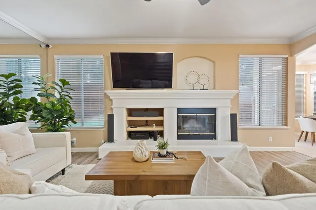a living room with furniture and a fireplace