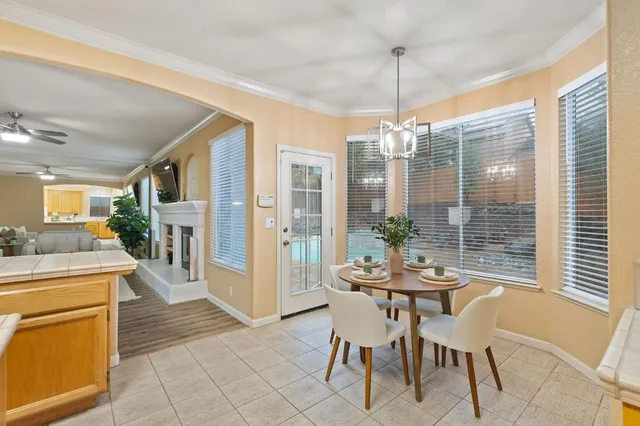 a kitchen with a stove sink and cabinets