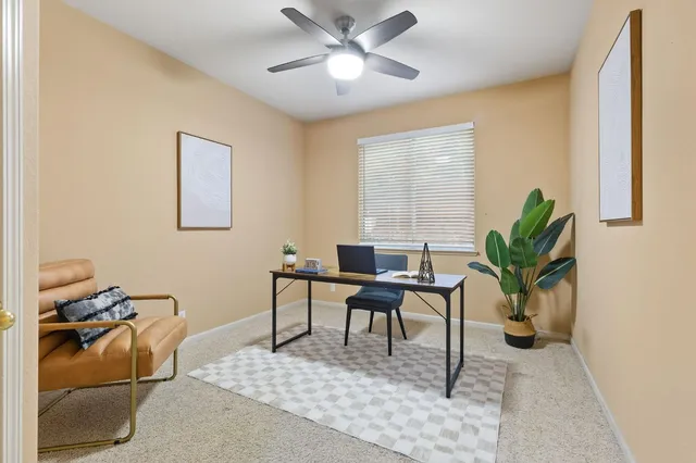 a view of a hallway with wooden floor and stairs