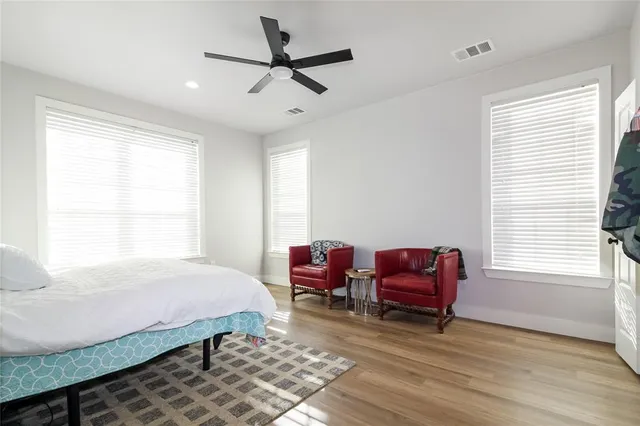 a bedroom with a bed and a couch