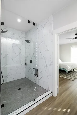 a bathroom with a granite countertop shower