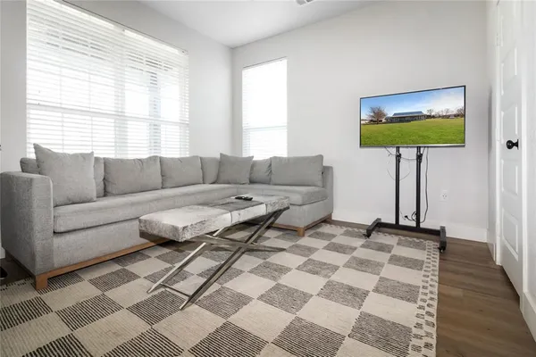 a living room with a couch and a large window
