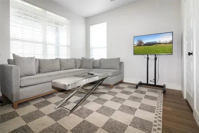 a living room with a couch and a large window