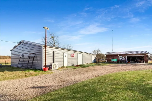 a view of a house with outdoor space and sitting area
