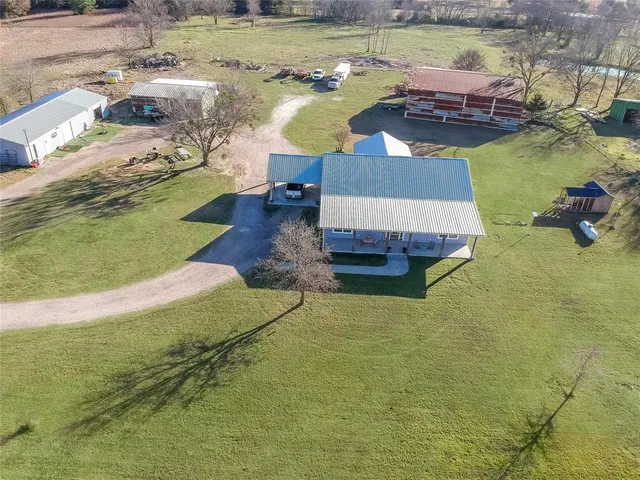 a swimming pool with some tall trees