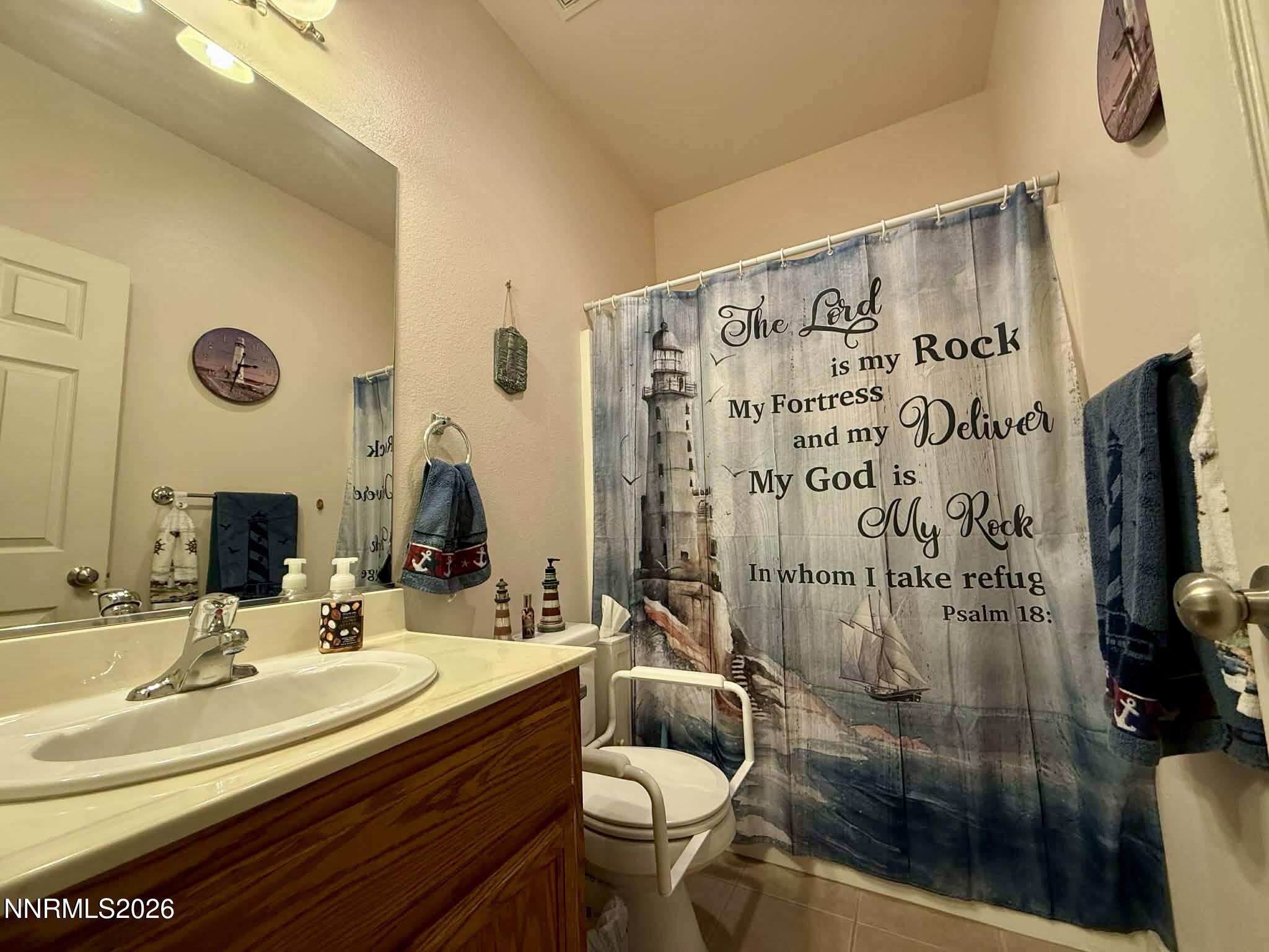 672 Cardinal Circle Fernley, NV 89408 - Photo 11 of 15 a bathroom with a sink and a mirror