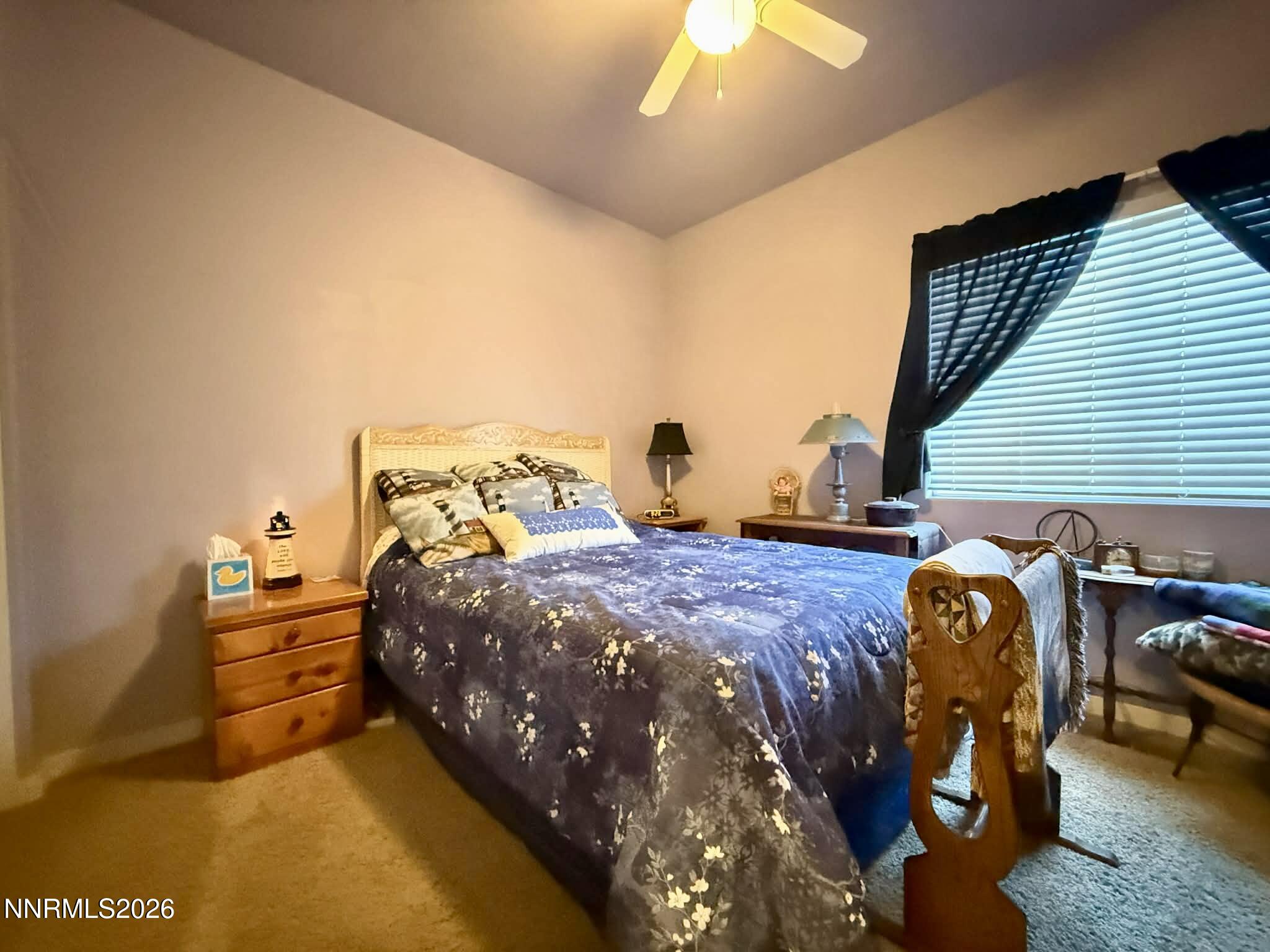672 Cardinal Circle Fernley, NV 89408 - Photo 12 of 15 a bedroom with bed and window