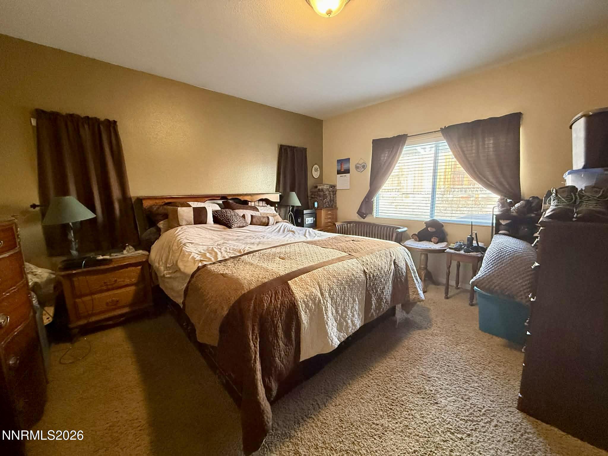 672 Cardinal Circle Fernley, NV 89408 - Photo 13 of 15 a bed room with a bed and a television