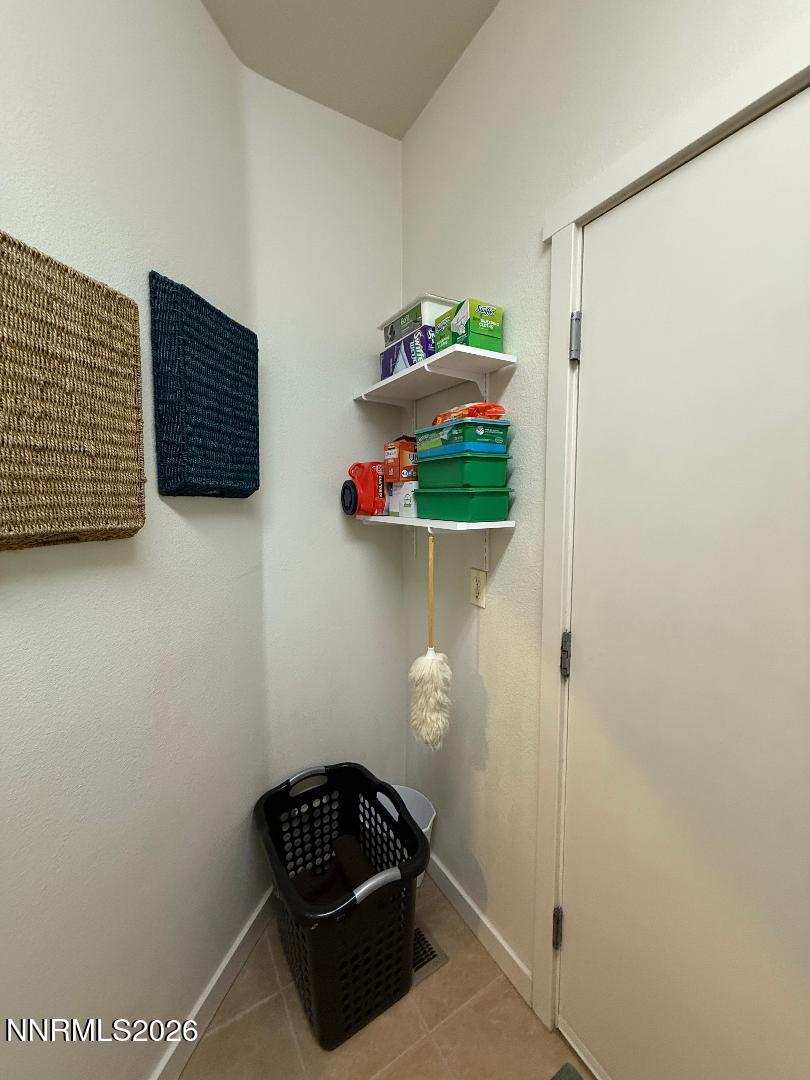 672 Cardinal Circle Fernley, NV 89408 - Photo 9 of 15 a room that has a lamp and a wooden floor