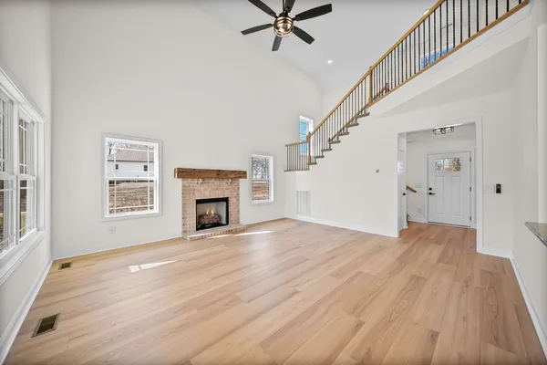 a view of kitchen with sink and wooden floor