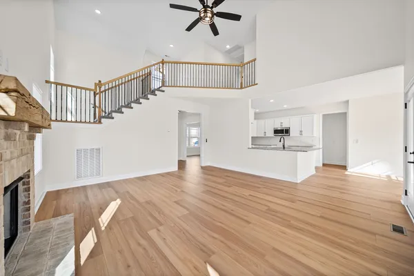 a view of kitchen with cabinets and wooden floor