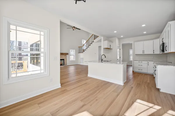 a kitchen with granite countertop a stove a sink and a granite counter tops