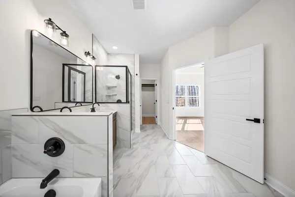 a bathroom with a glass shower door