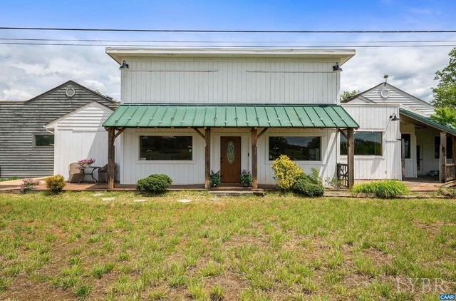 1900 Lowesville Road Amherst, VA 24521 - Photo 1 of 1 a front view of a house with garden