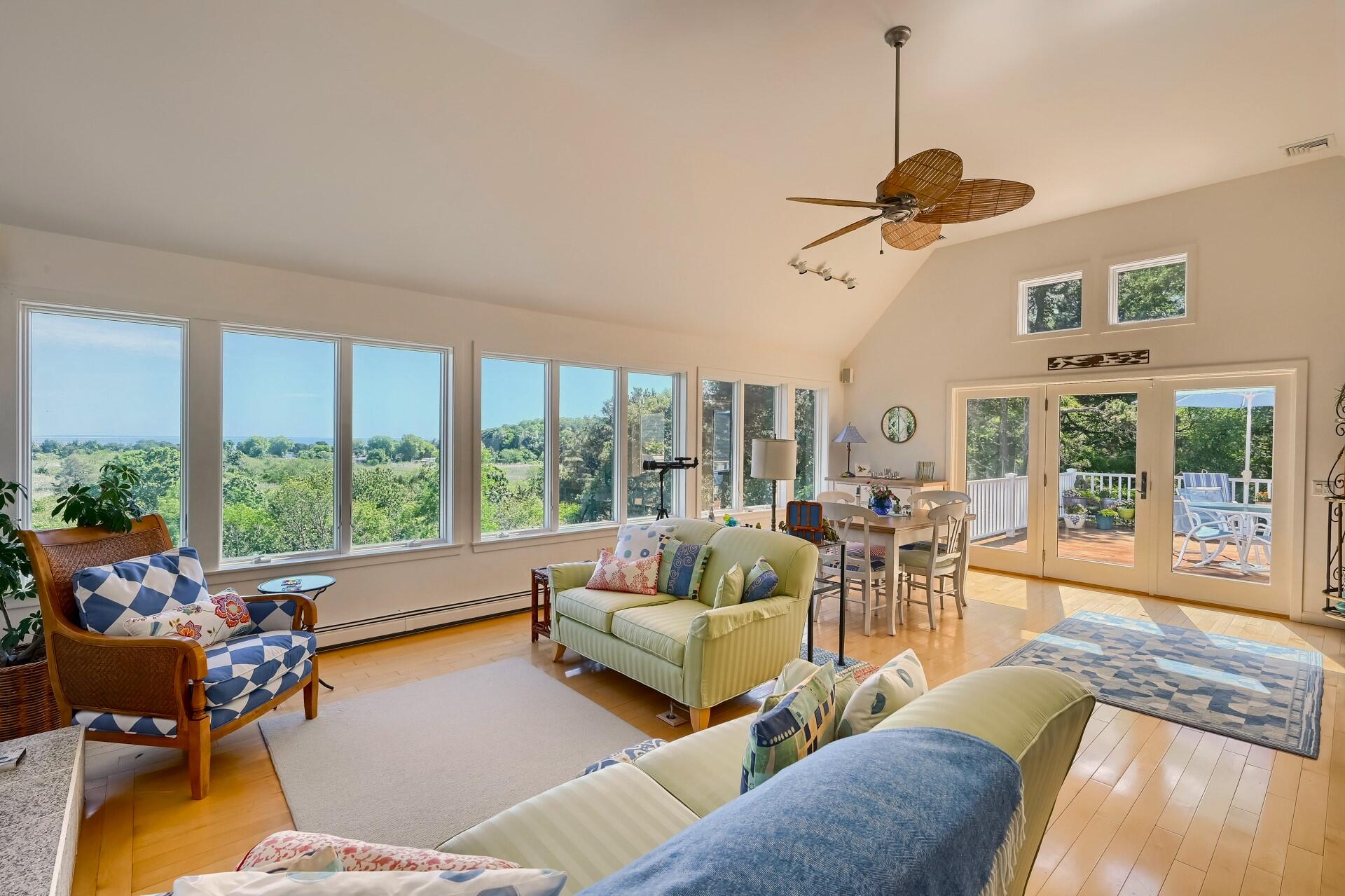 95 Chequessett Neck Road Wellfleet, MA 02667 - Photo 13 of 75 a living room with furniture and a large window
