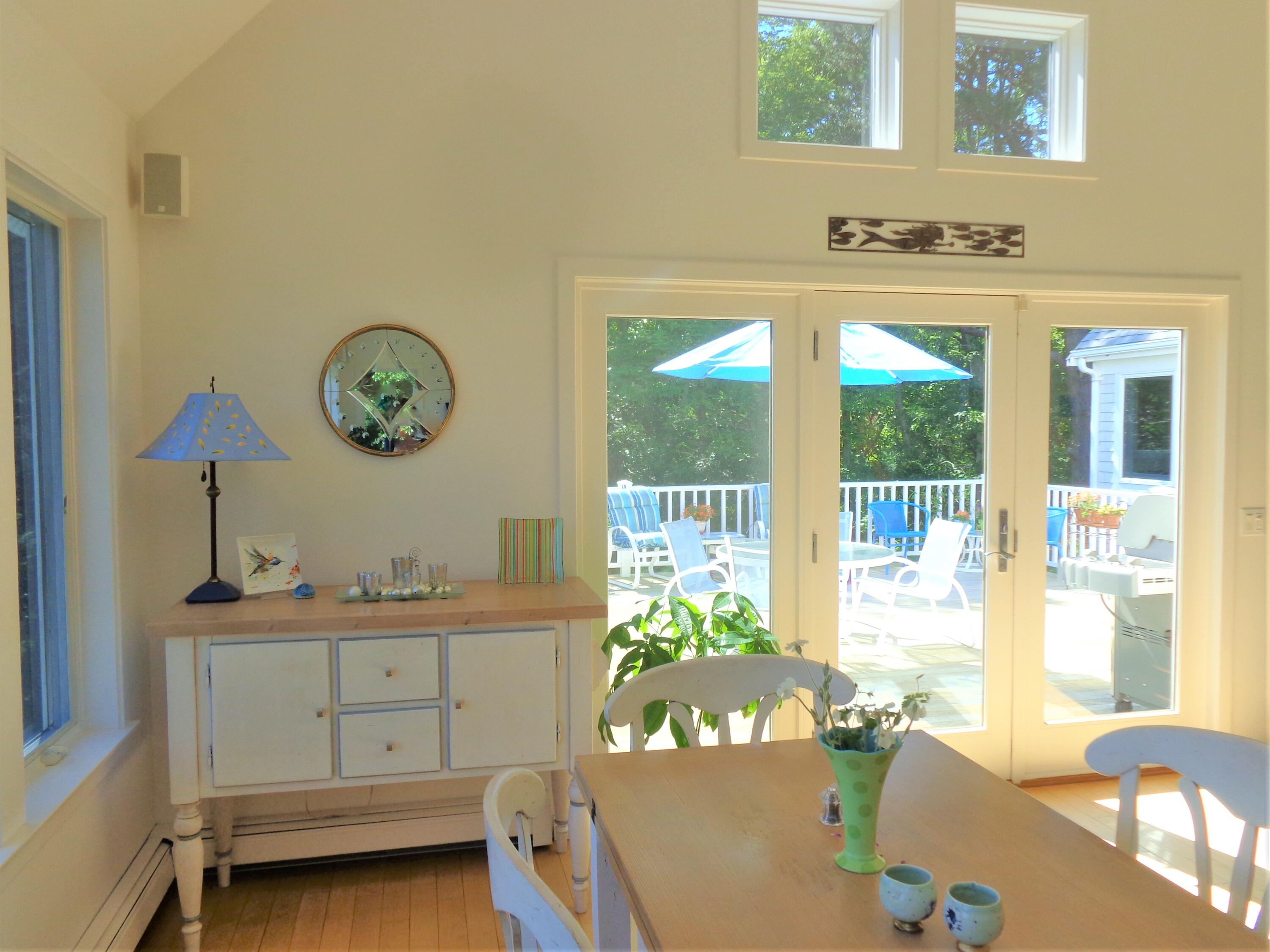 95 Chequessett Neck Road Wellfleet, MA 02667 - Photo 14 of 75 a living room with a bed furniture and a window