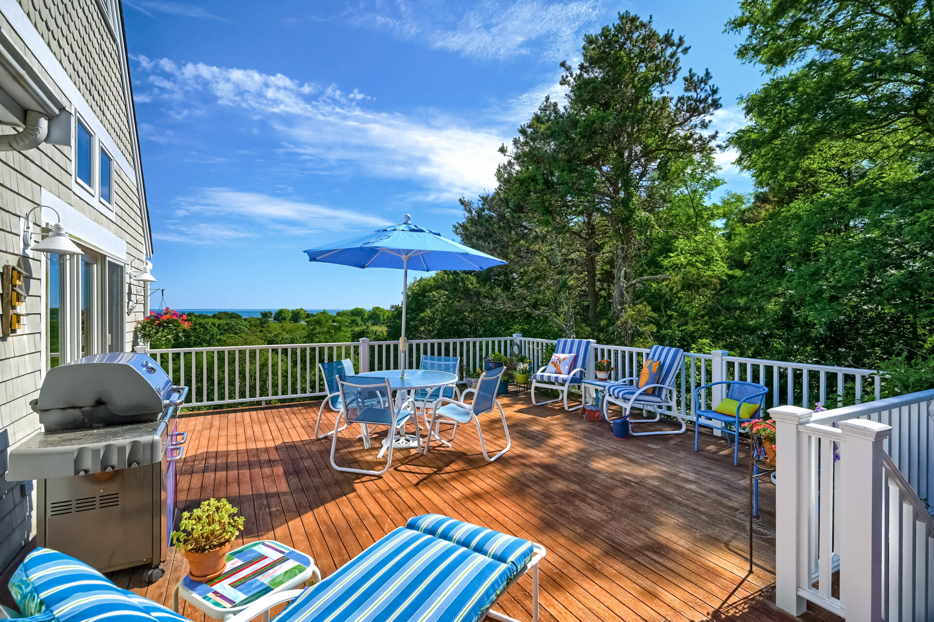 95 Chequessett Neck Road Wellfleet, MA 02667 - Photo 17 of 75 a view of a roof deck with couches chairs and wooden floor