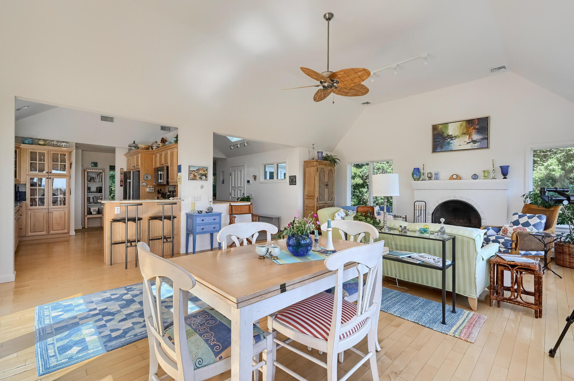 95 Chequessett Neck Road Wellfleet, MA 02667 - Photo 20 of 75 a living room with furniture a dining table and a fireplace
