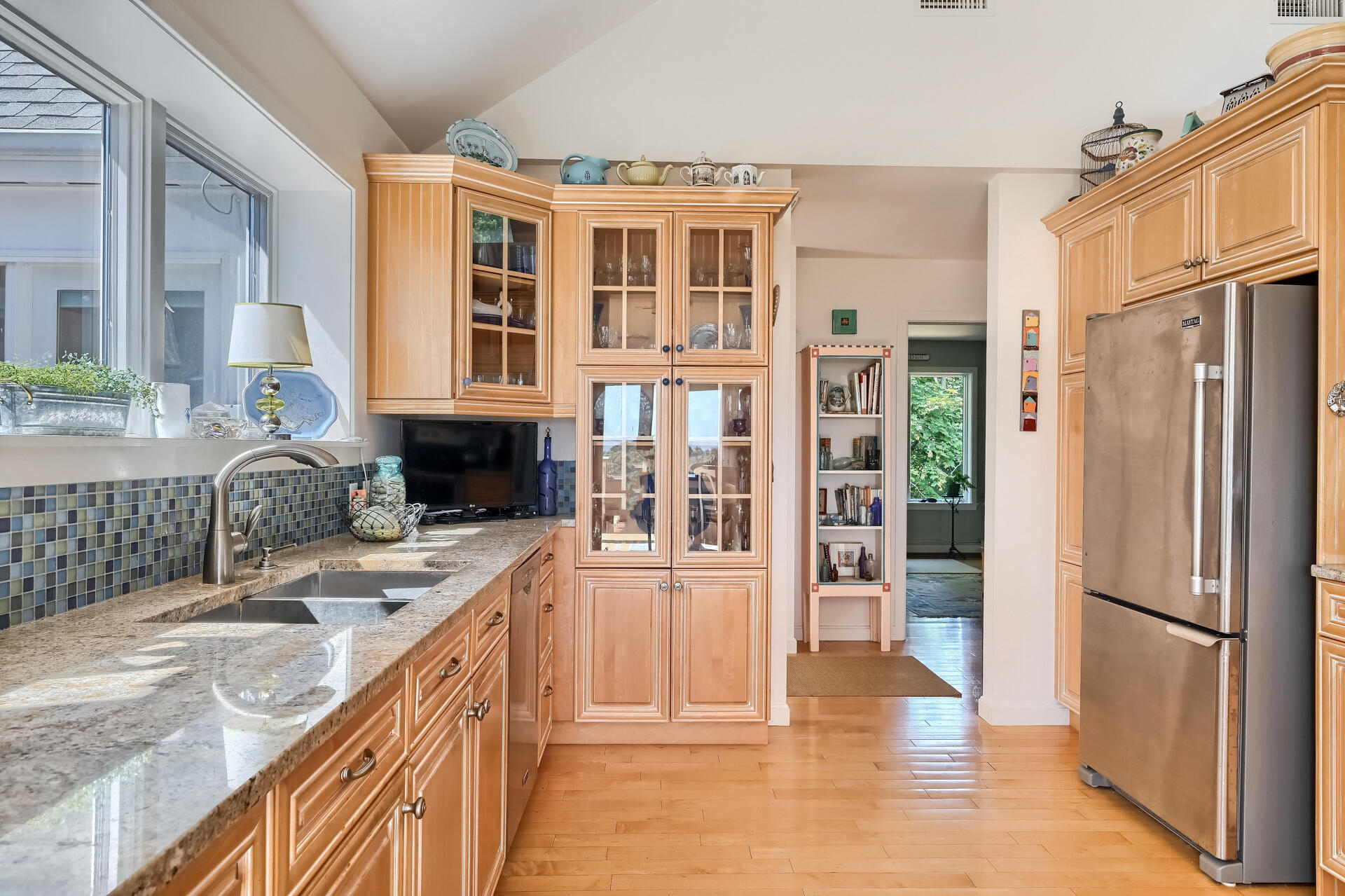 95 Chequessett Neck Road Wellfleet, MA 02667 - Photo 22 of 75 a kitchen with stainless steel appliances granite countertop a refrigerator and a sink