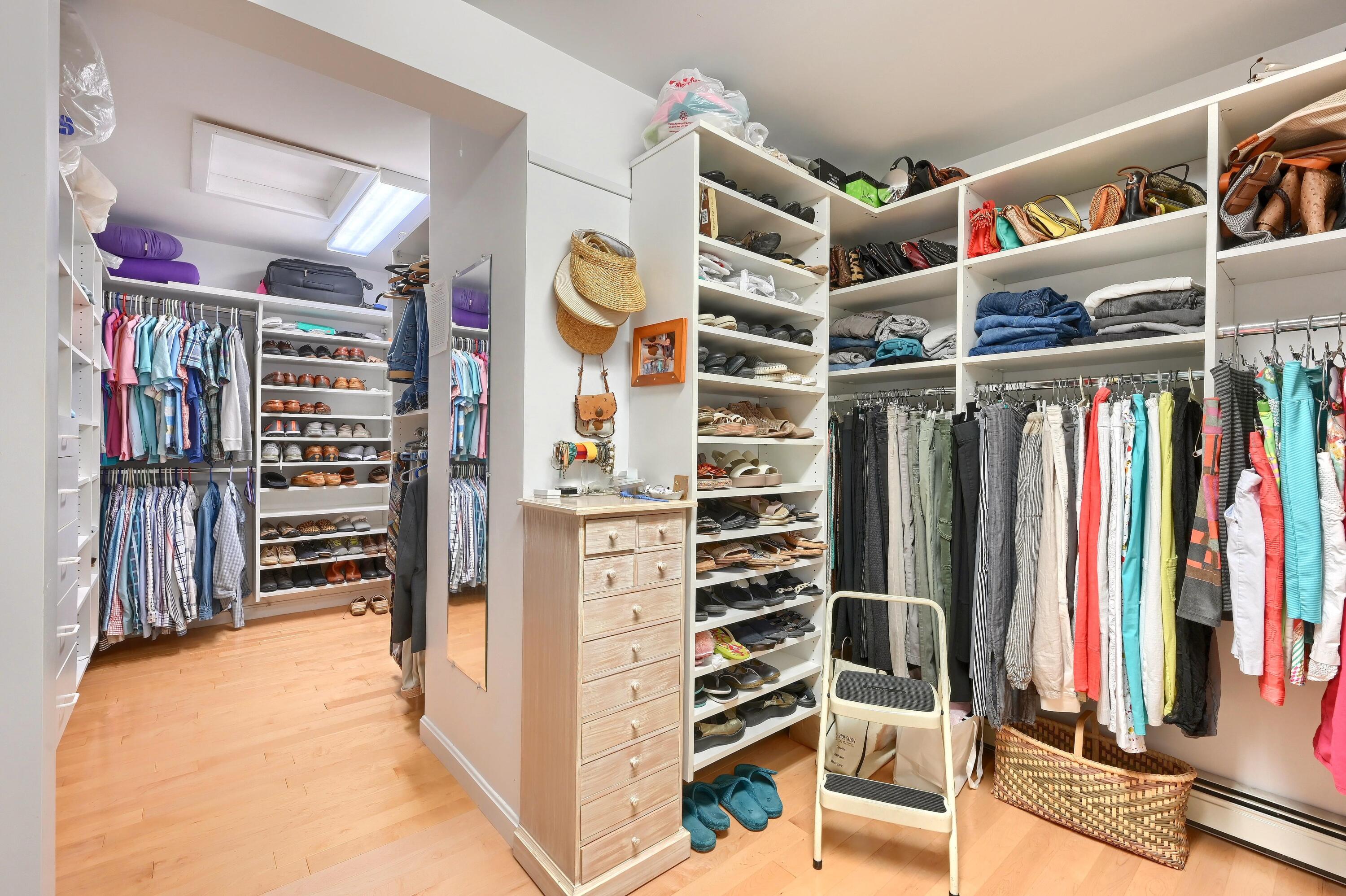 95 Chequessett Neck Road Wellfleet, MA 02667 - Photo 34 of 75 a view of walk in closet with clothes and shoes