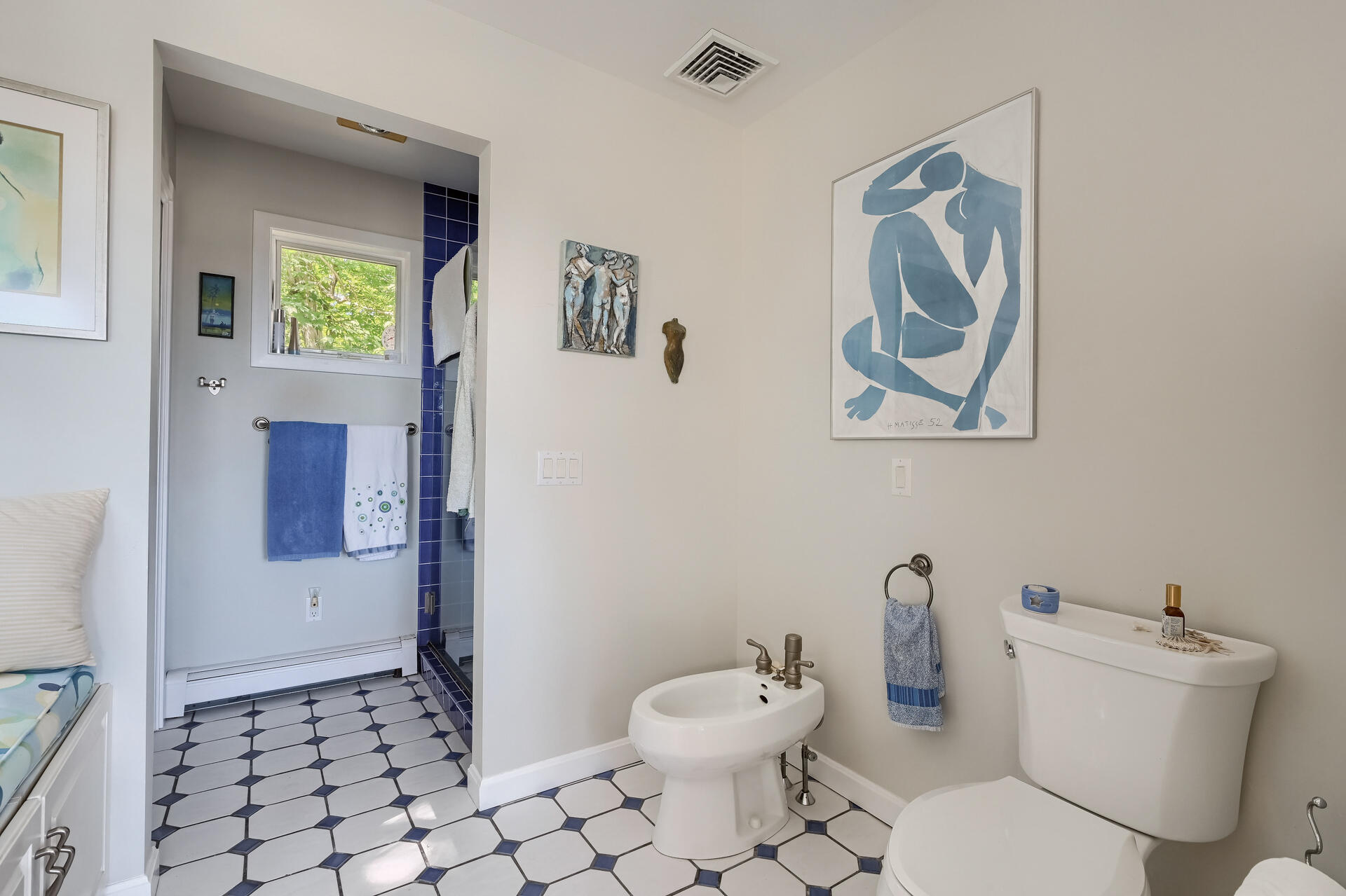 95 Chequessett Neck Road Wellfleet, MA 02667 - Photo 39 of 75 a white toilet sitting next to a bathroom sink