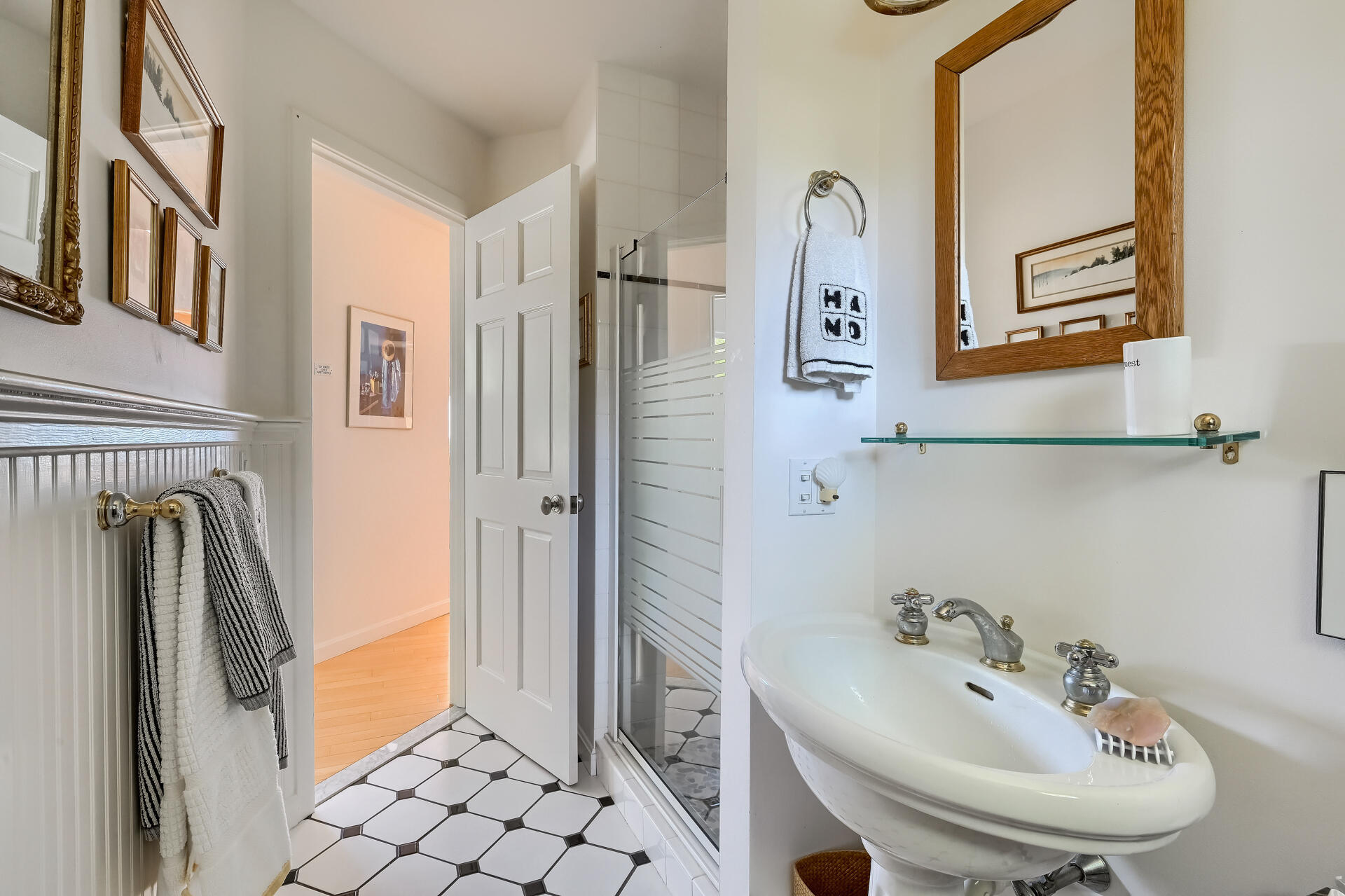 95 Chequessett Neck Road Wellfleet, MA 02667 - Photo 49 of 75 a bathroom with a sink a mirror and a shower