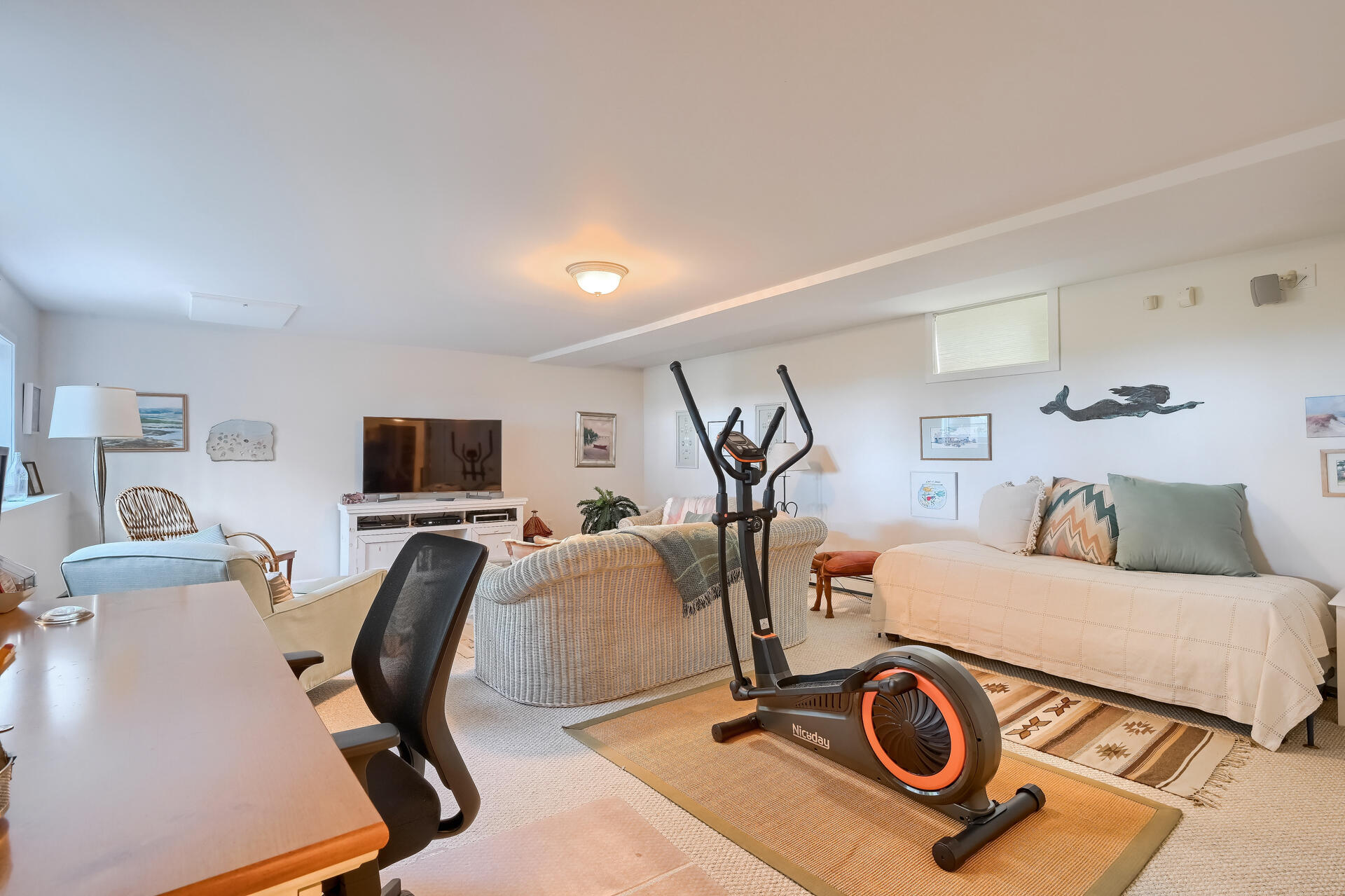 95 Chequessett Neck Road Wellfleet, MA 02667 - Photo 55 of 75 a view of a workspace with furniture and a flat screen tv