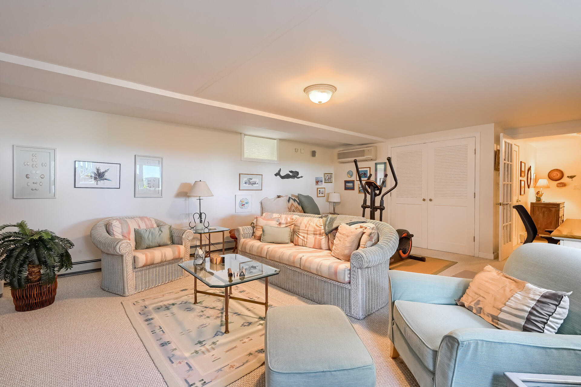 95 Chequessett Neck Road Wellfleet, MA 02667 - Photo 56 of 75 a living room with furniture and a potted plant