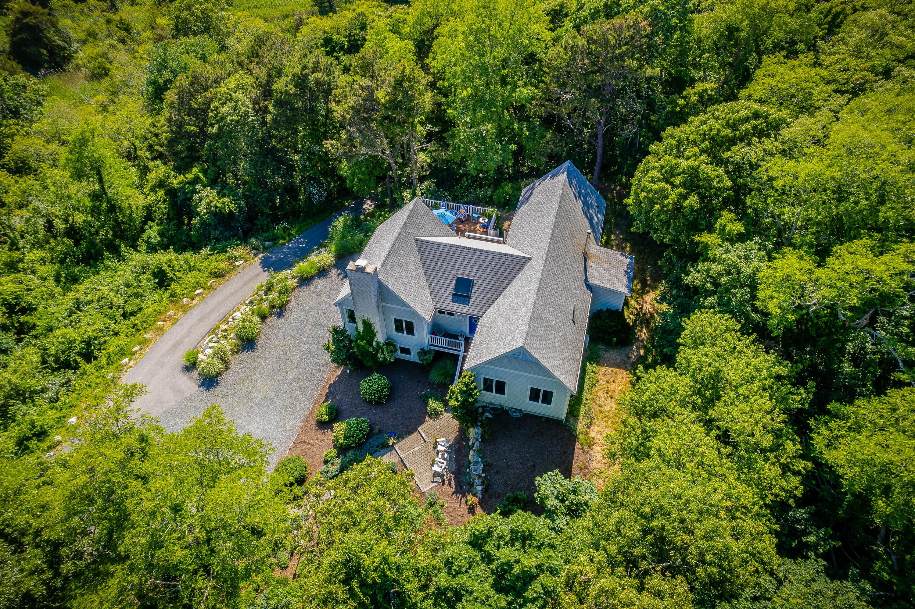 95 Chequessett Neck Road Wellfleet, MA 02667 - Photo 60 of 75 an aerial view of a house with swimming pool and garden view