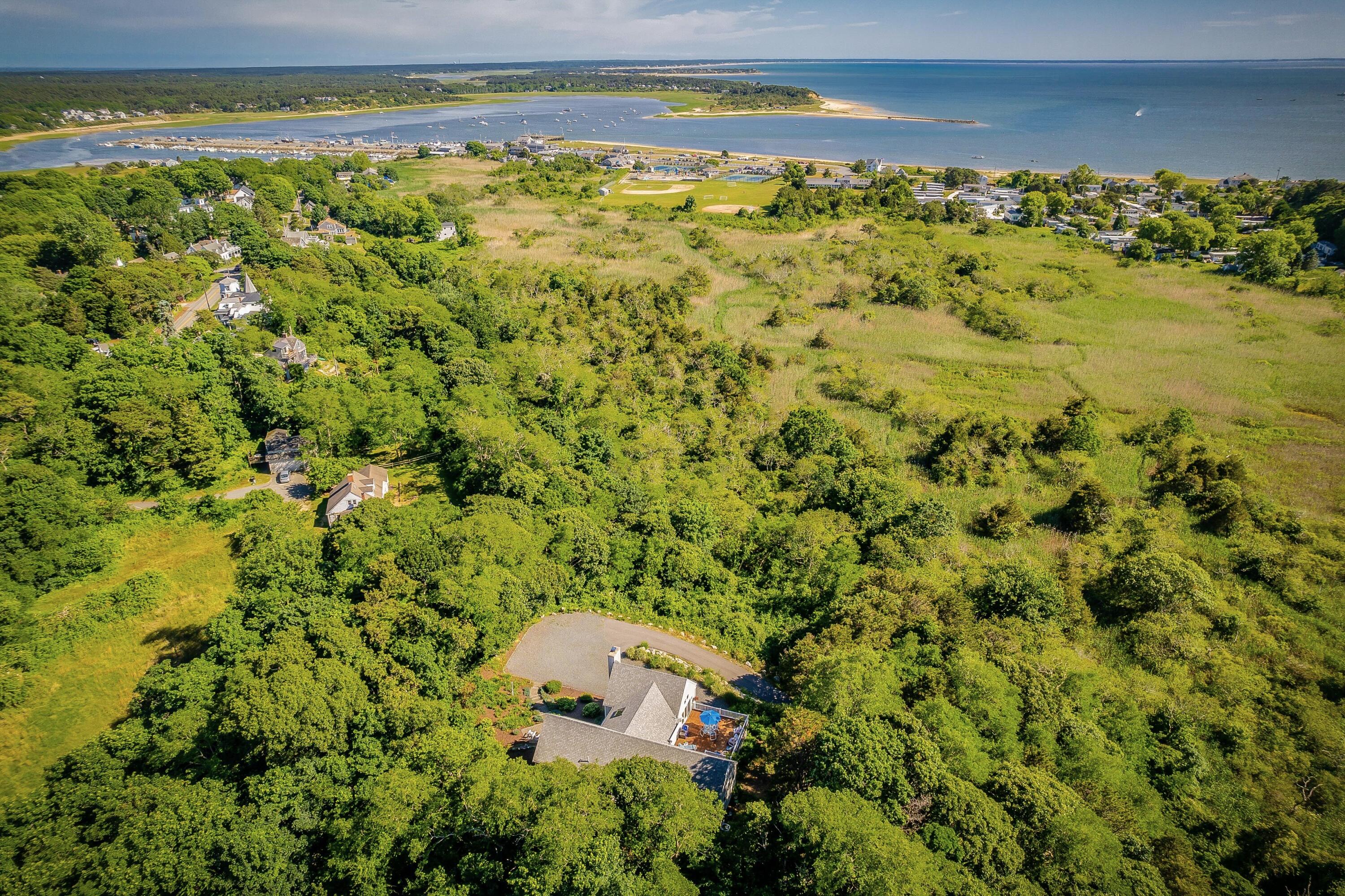95 Chequessett Neck Road Wellfleet, MA 02667 - Photo 62 of 75 a view of a yard with an outdoor space