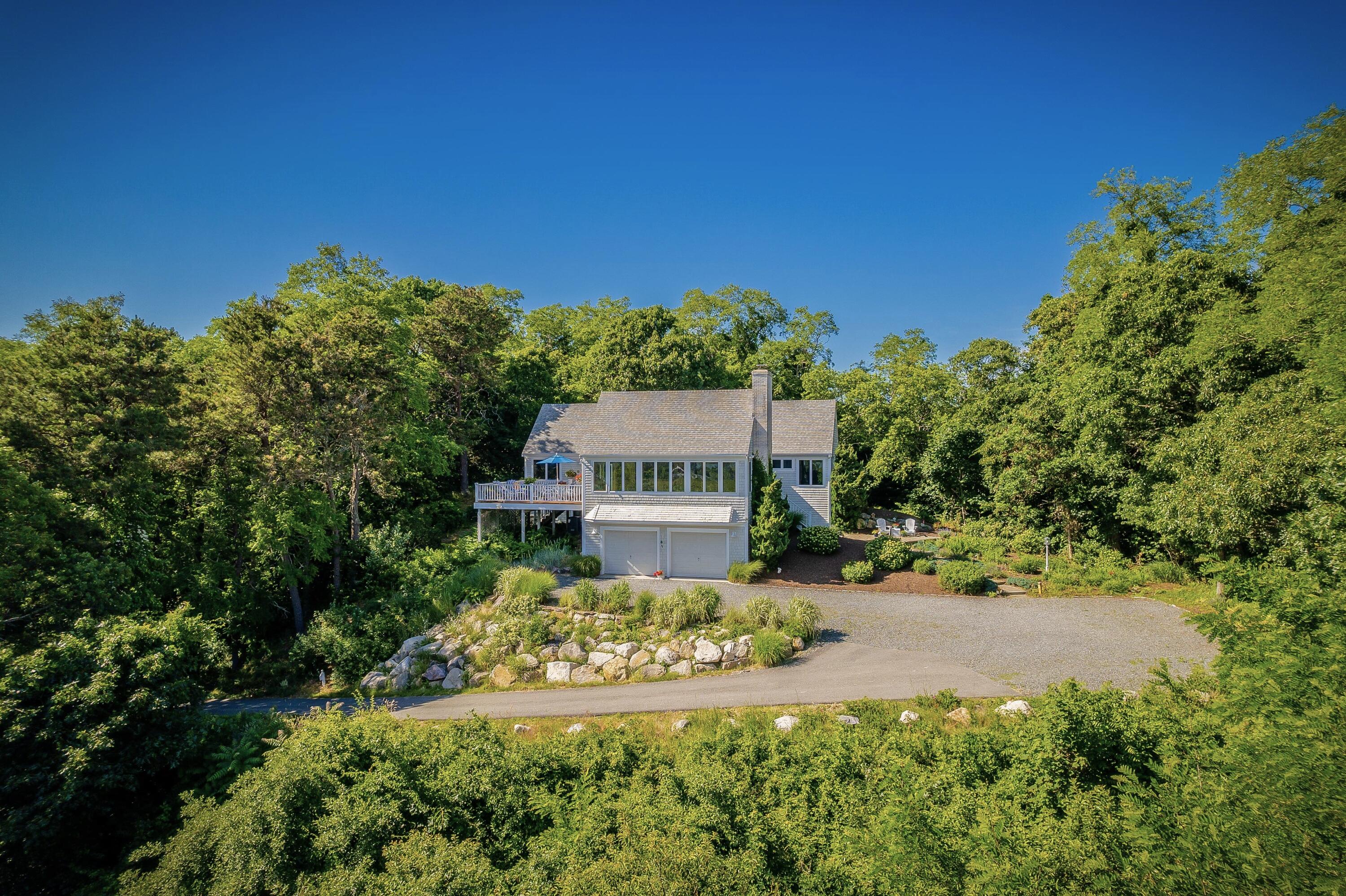 95 Chequessett Neck Road Wellfleet, MA 02667 - Photo 70 of 75 a view of a house with a yard