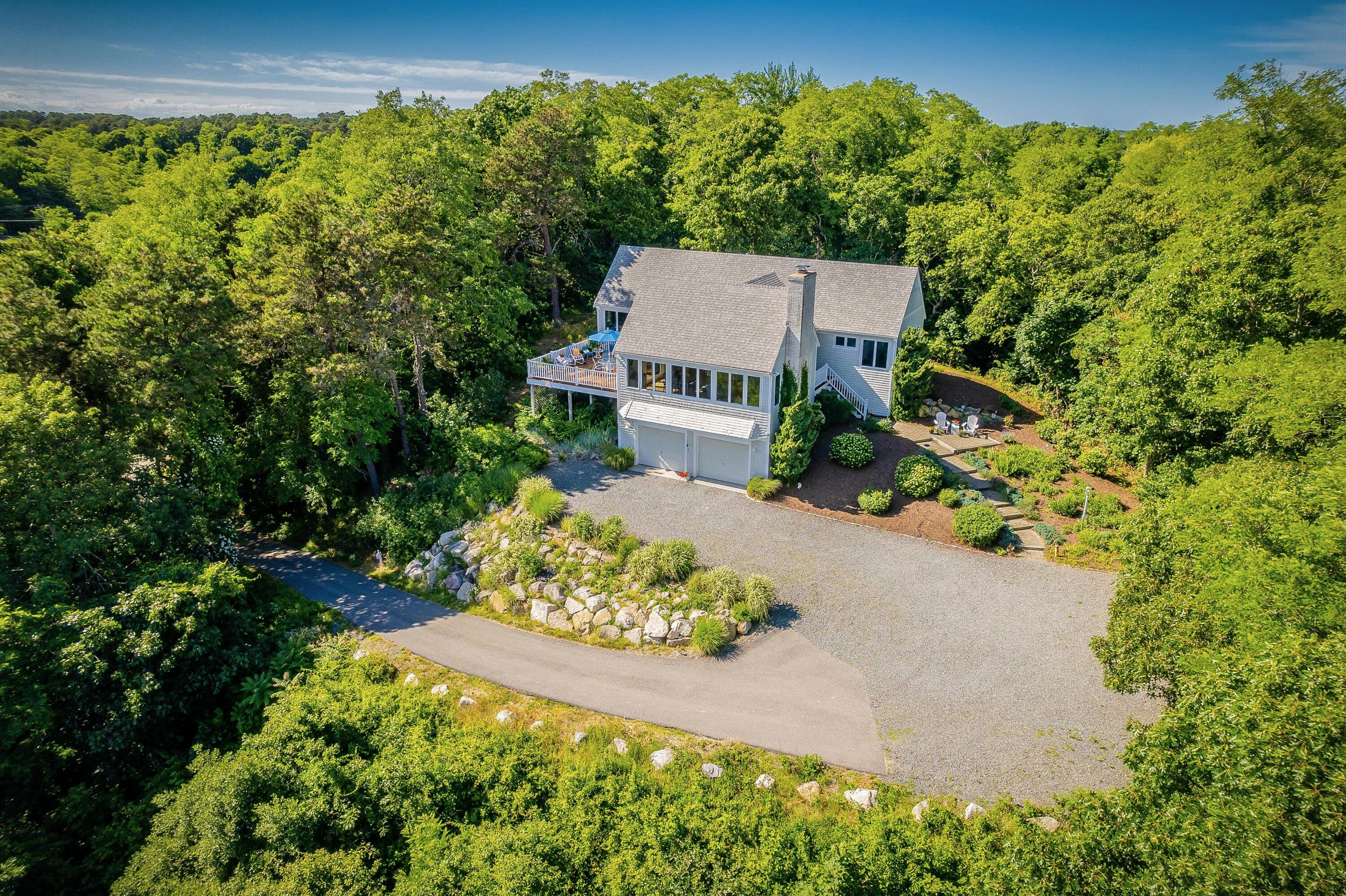 95 Chequessett Neck Road Wellfleet, MA 02667 - Photo 71 of 75 an aerial view of a house with a yard