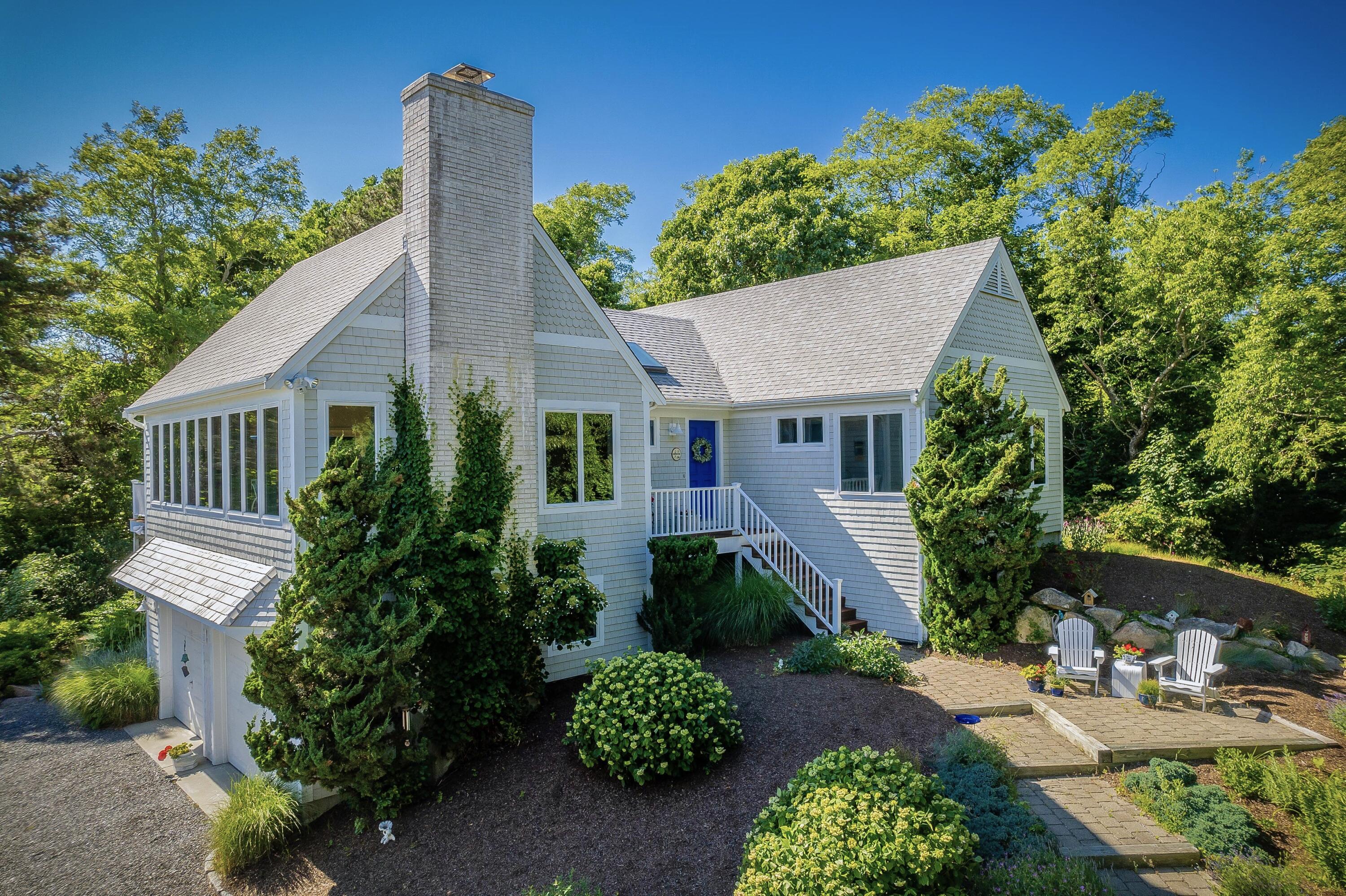 95 Chequessett Neck Road Wellfleet, MA 02667 - Photo 73 of 75 front view of a house with a yard