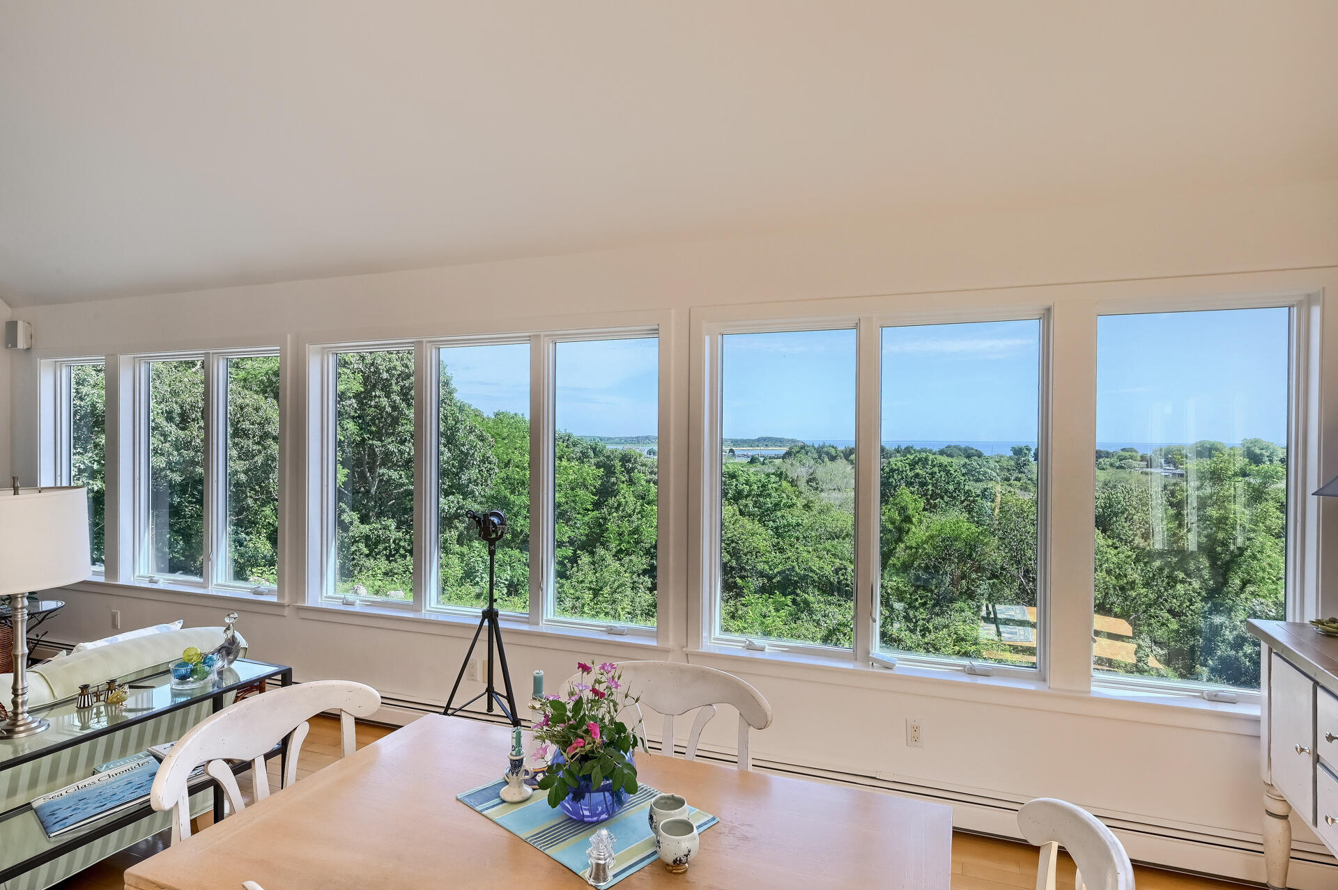95 Chequessett Neck Road Wellfleet, MA 02667 - Photo 9 of 75 a living room with furniture and floor to ceiling windows